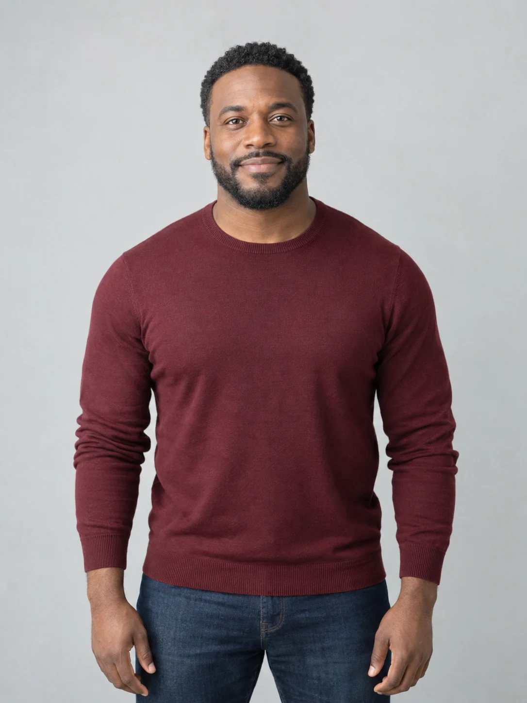 Fictional adult in a burgundy sweater used as the portrait test input