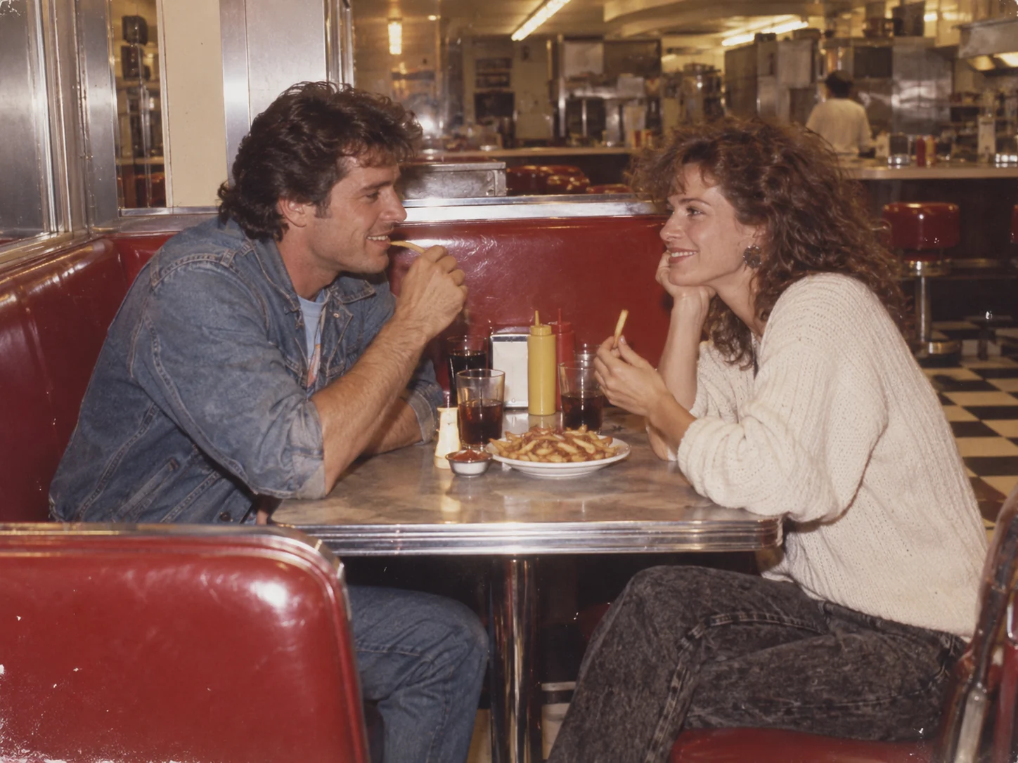 Original AI-generated example of a fictional adult couple sharing a late-night diner booth in 1984.