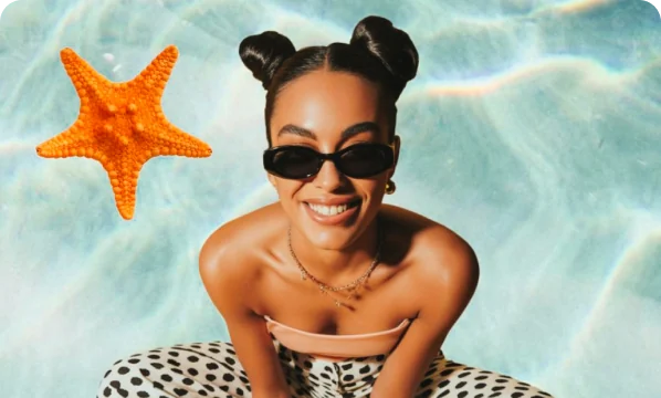 Creative portrait in a pool beside an orange starfish
